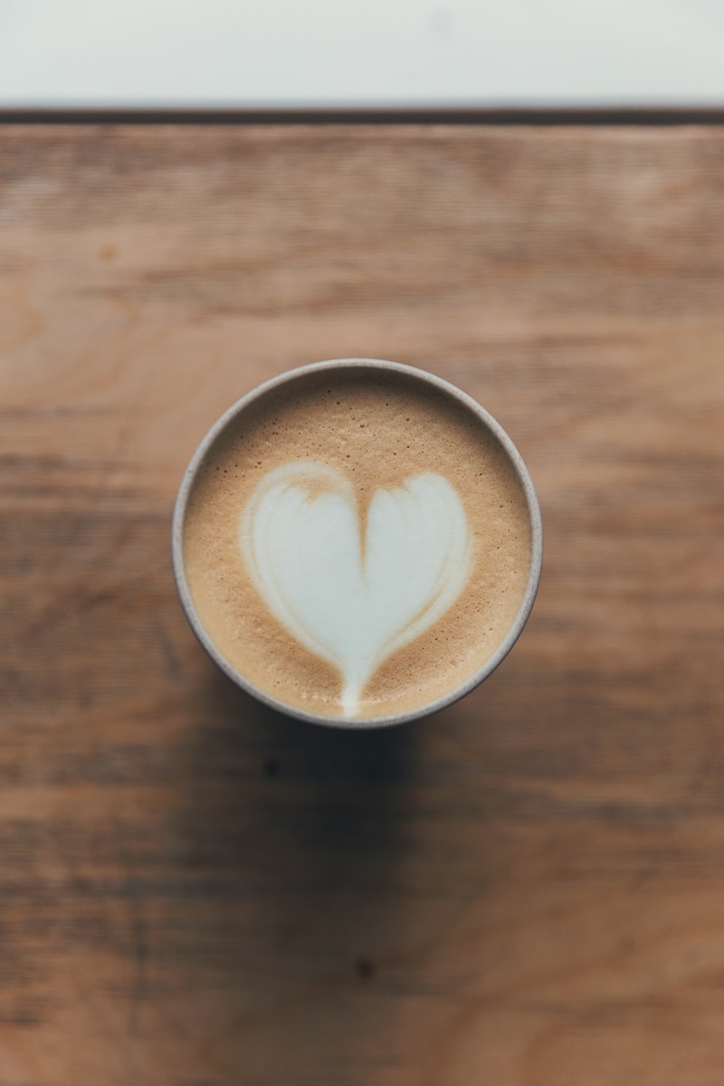 brown and white heart shaped coffee art